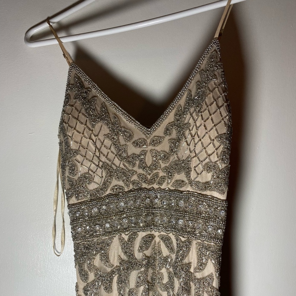 Selling this beautiful elegant dress. Worn one time for a wedding!